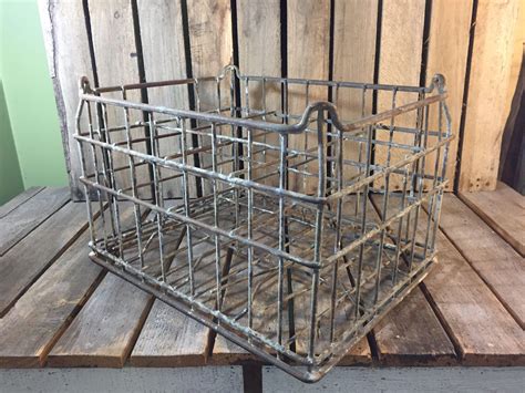 vintage milk bottles in metal box|old fashioned metal milk crates.